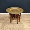 Oriental coffee table with brass top & folding wooden leg