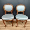 Pair of small antique carved wooden chairs in need of restoration