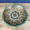 Large antique dish from the Maghreb with green and yellow rosettes