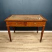 Late 19th century wood veneer and leather covered flat desk